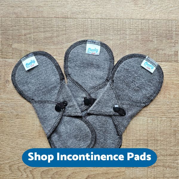 Three charcoal incontinence pads