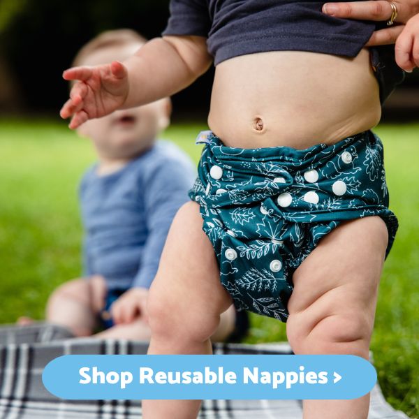 Shop Reusable Nappies - image of baby standing wearing a reusable nappy